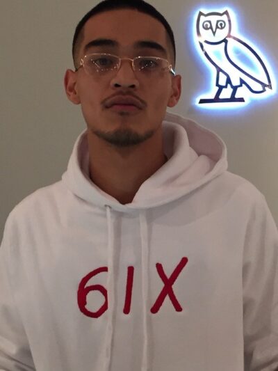 OVO Store sales rep wears new 6IX white sweatshirt with red lettering